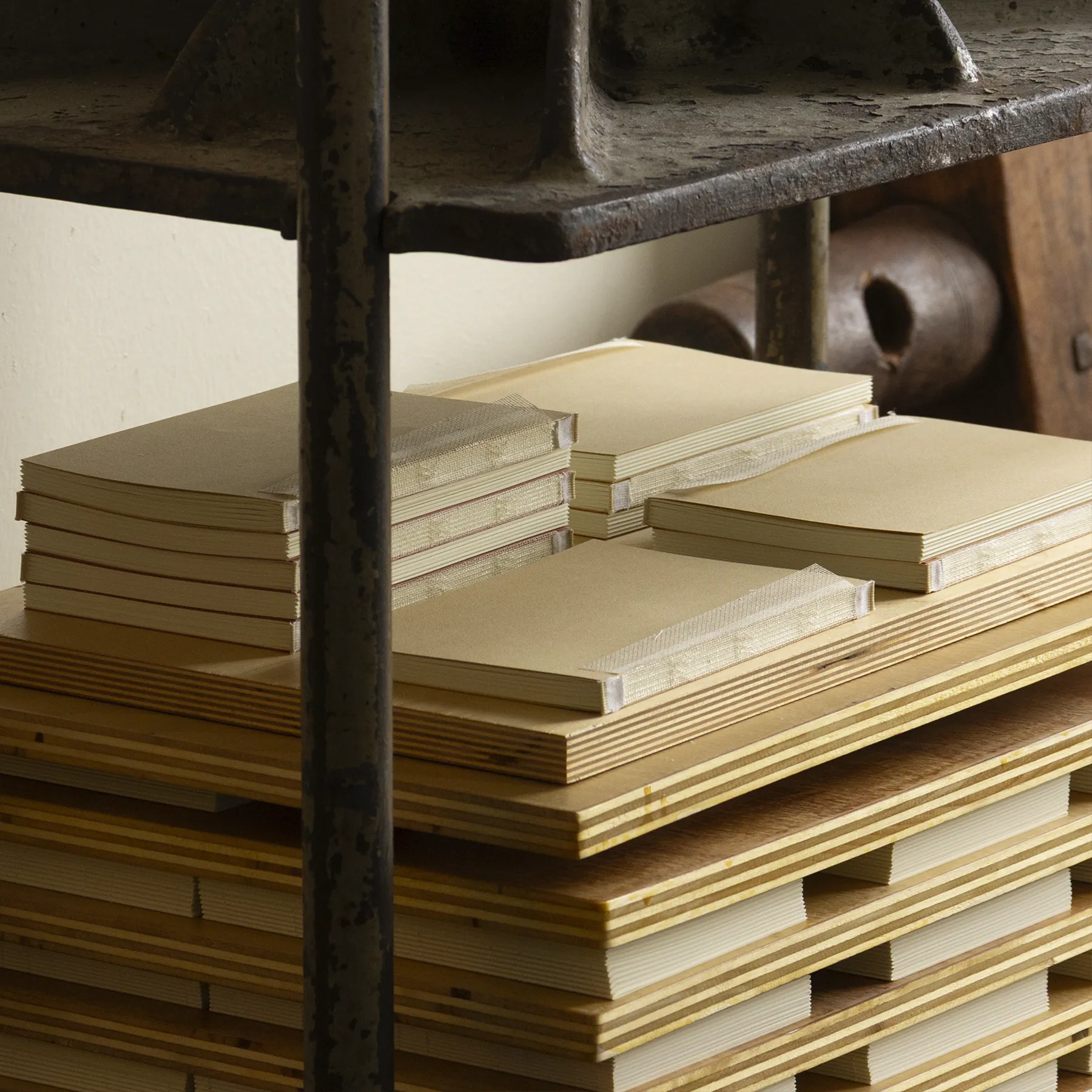 a stack of books on a bench